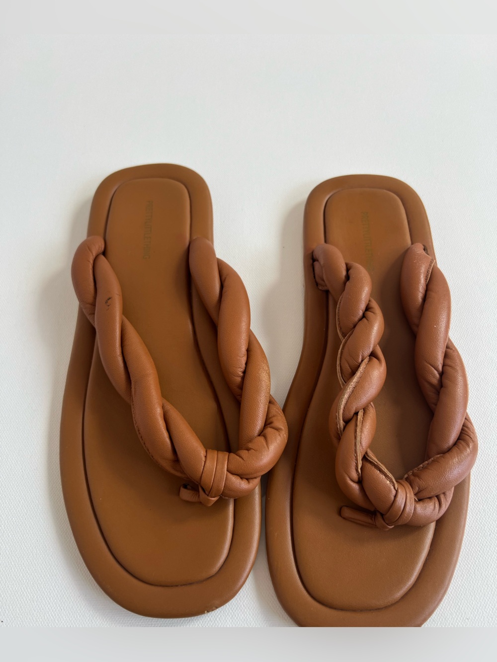 Pretty Little Thing Braided Leather Flip Flop Sandals in Cognac